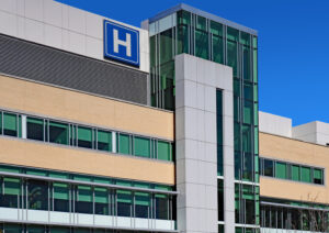 modern style building with large h sign for hospital